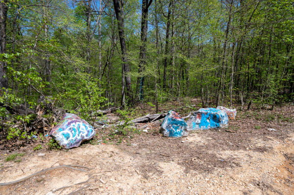 Graffiti-covered rocks at path to Hotel California